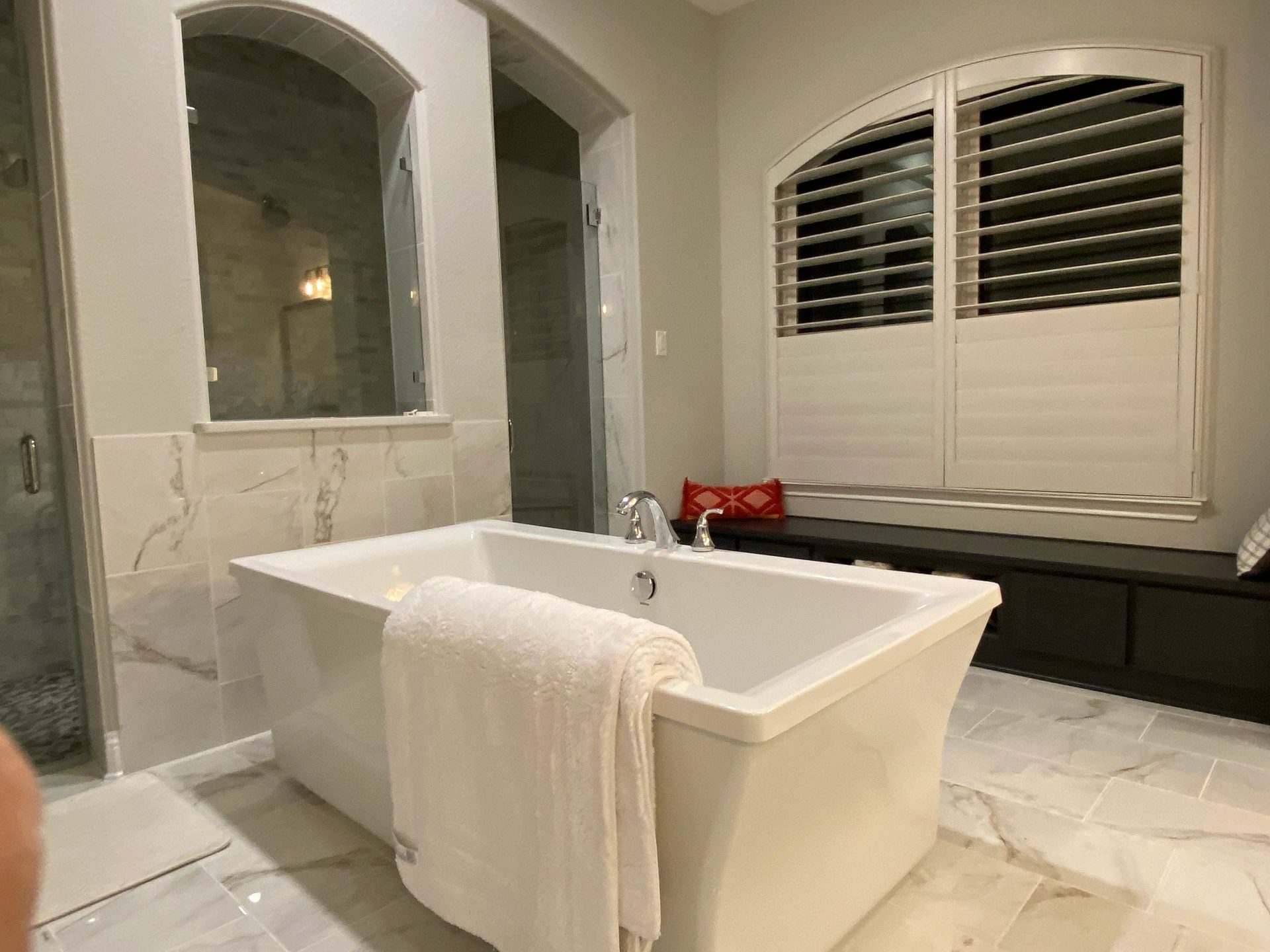 Freestanding tub bathroom with custom shutters