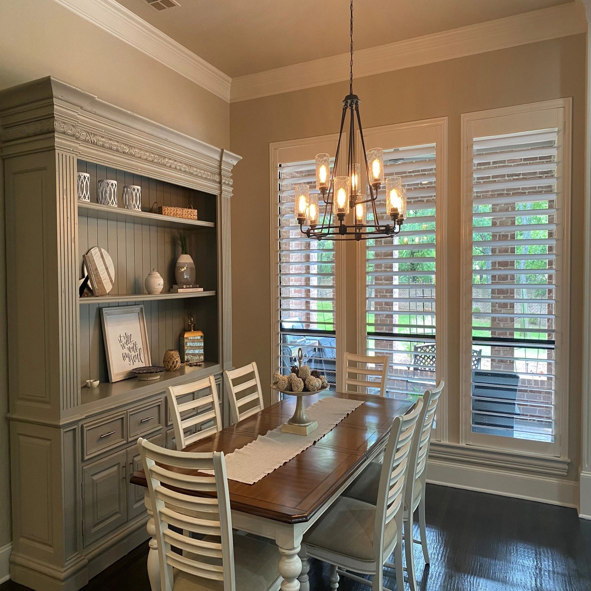 Dining room with built-in hutch and custom shutters